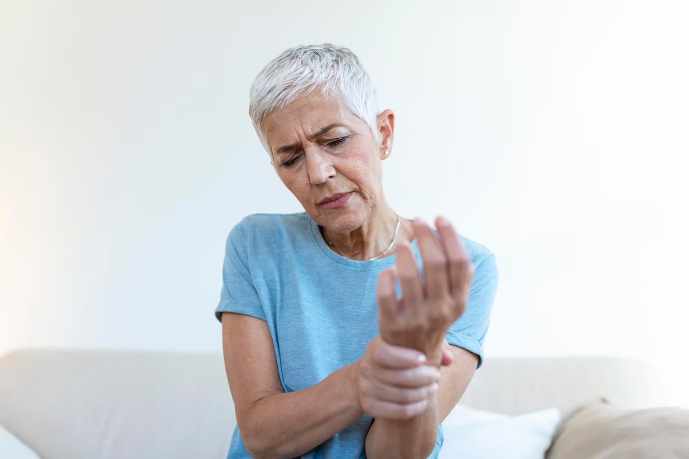 Elderly Woman Suffering From Pain Hand Arthritis
