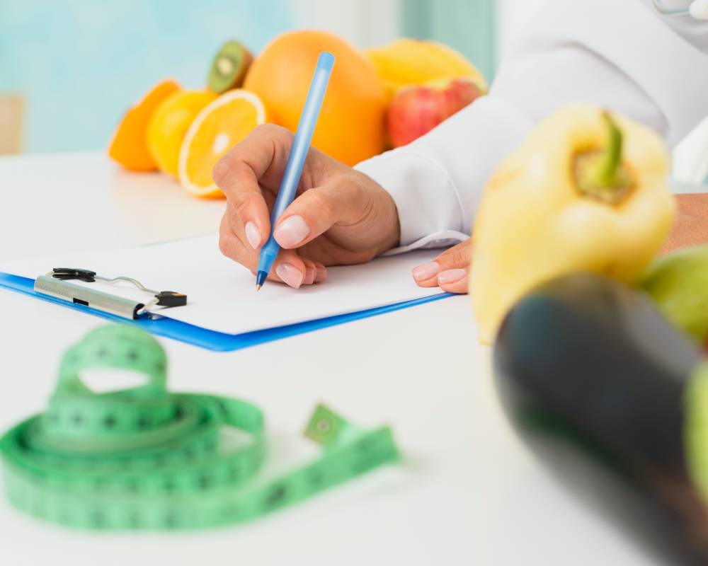 close-up-nutritionist-writing-prescription-1.jpg