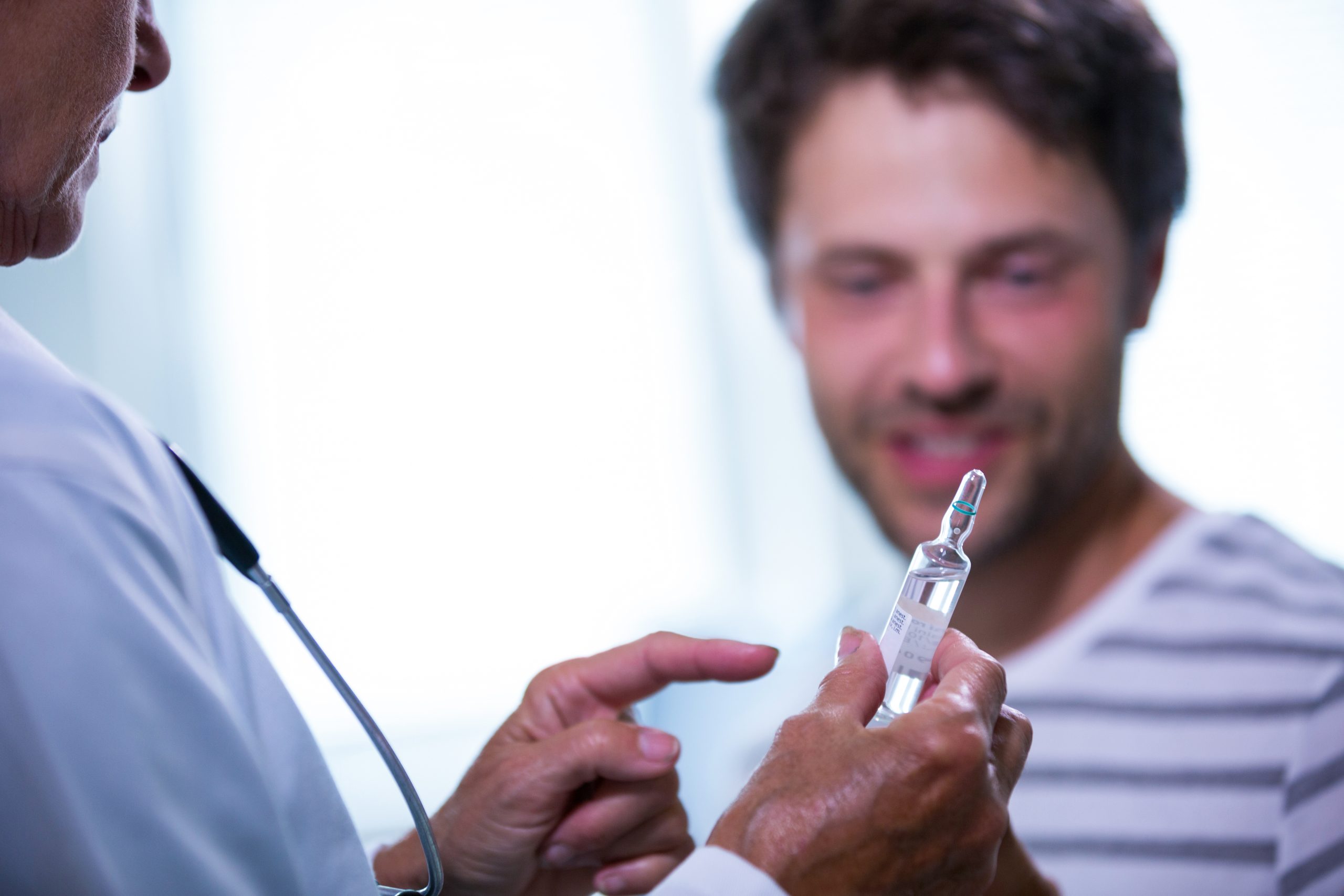 doctor-showing-injection-patient-scaled.jpg