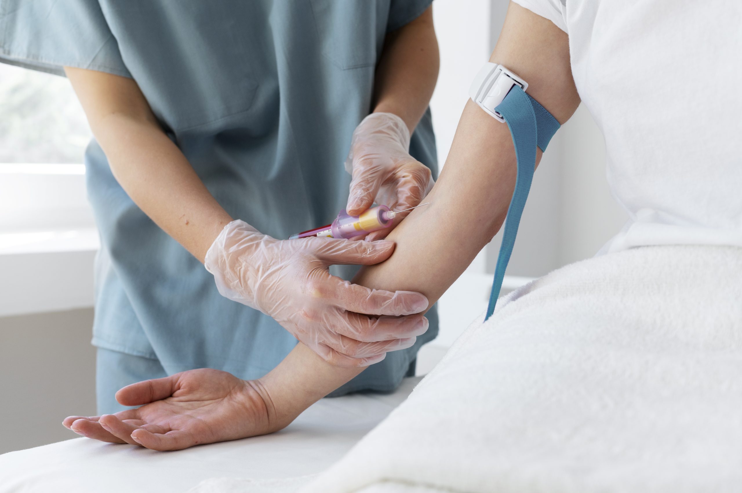 high-angle-health-professional-drawing-blood-prp-treatment-scaled.jpg