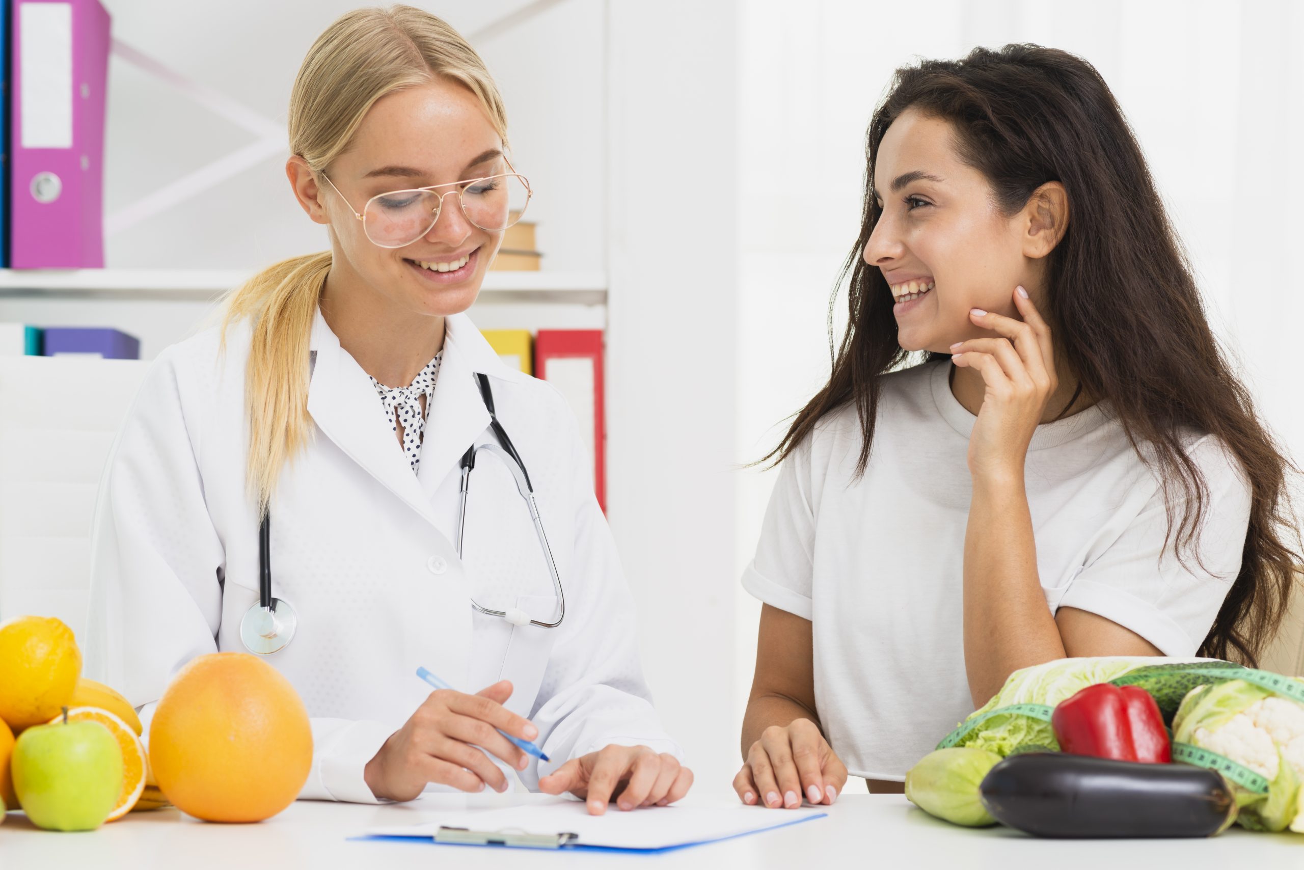 medium-shot-smiley-doctor-patient-talking-scaled.jpg