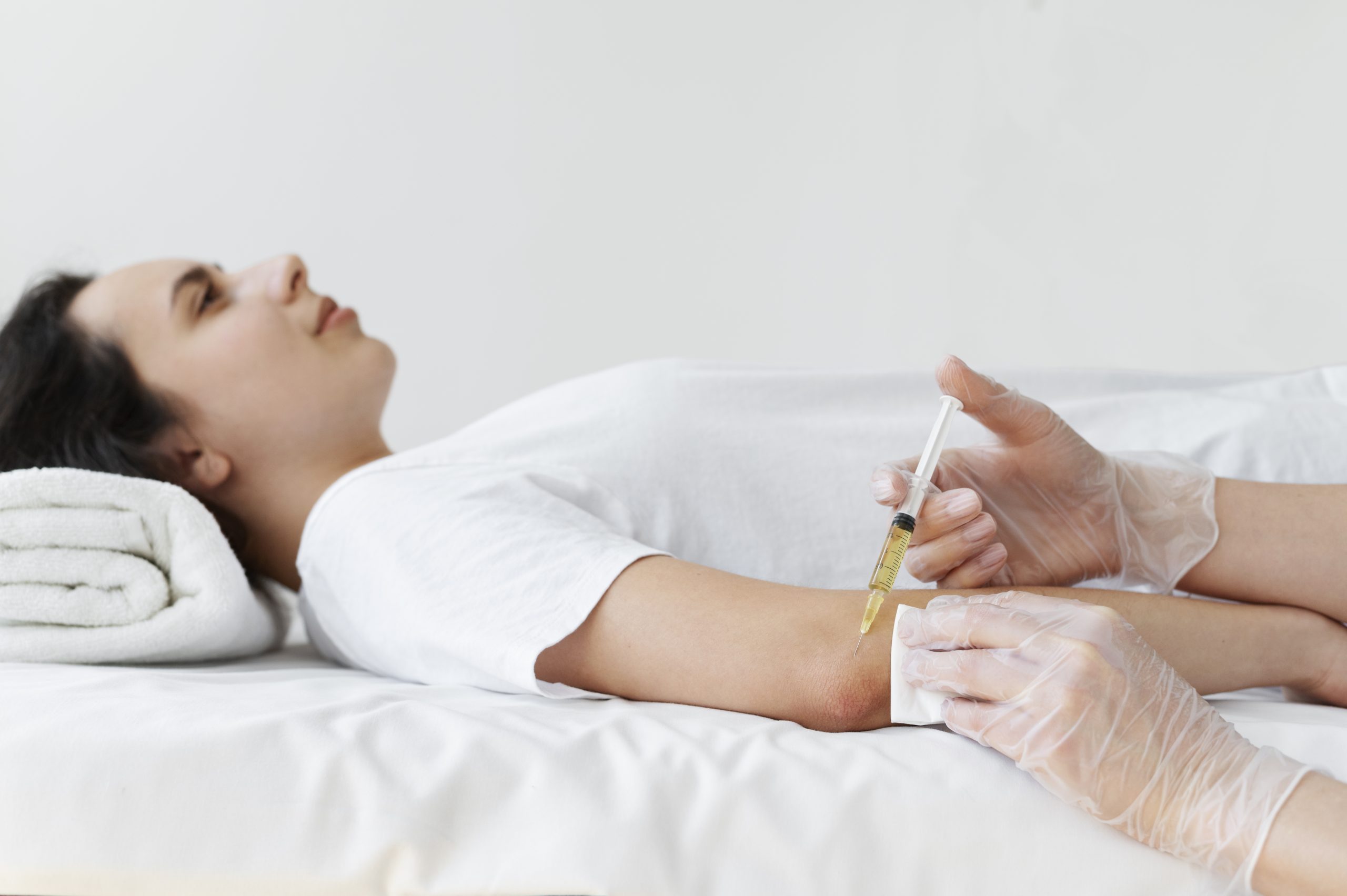side-view-woman-getting-elbow-prp-treatment-scaled.jpg