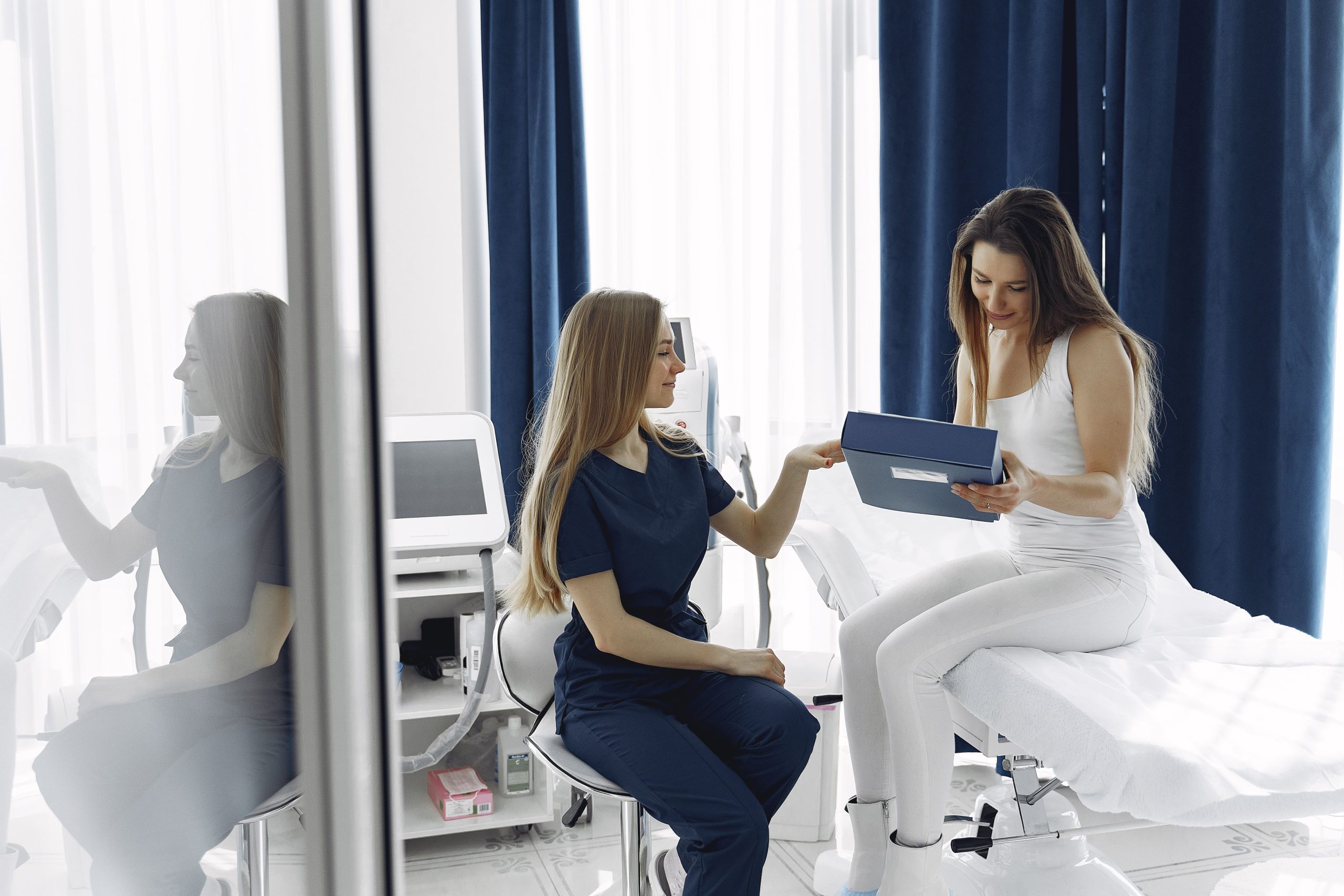 woman-with-doctor-cosmetology-studio-min-scaled.jpg