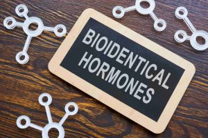 Board with 'Bioidentical Hormones' written on it.