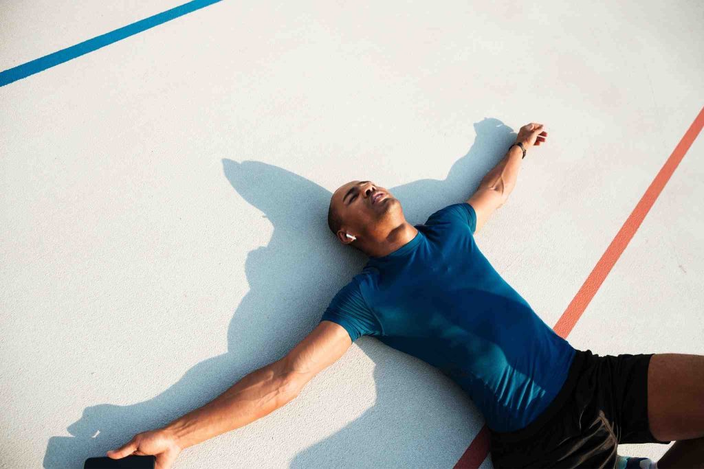 Men Laying on ground because of tiredness