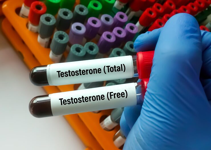 scientist holding test tubes