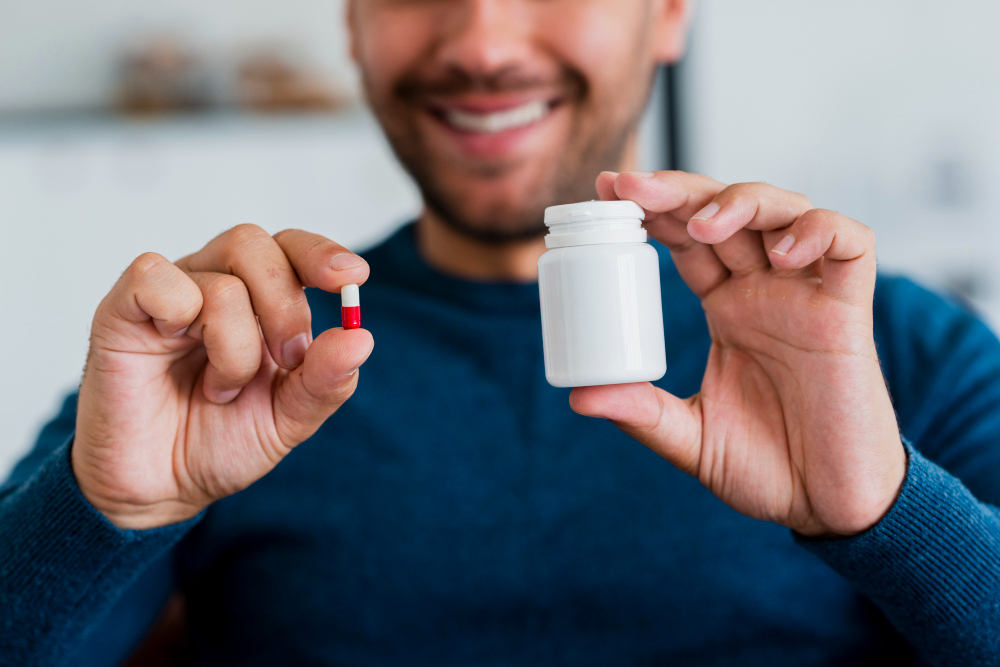 Middle-aged man taking testosterone pills.