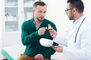 Male patient consulting with doctor about medication