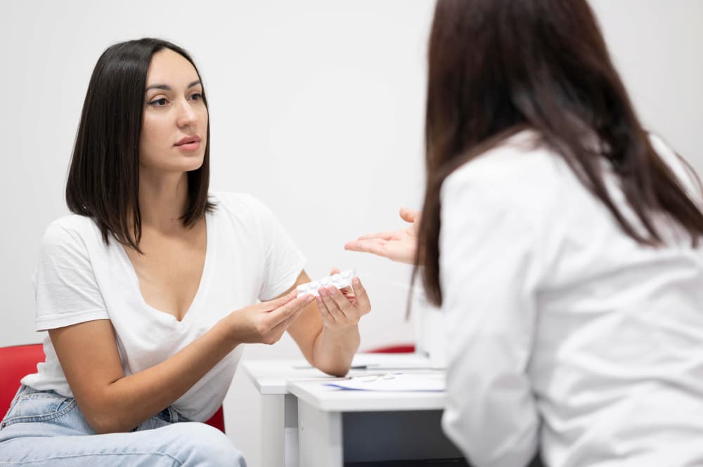 doctor explains the patient how hormone therapy works