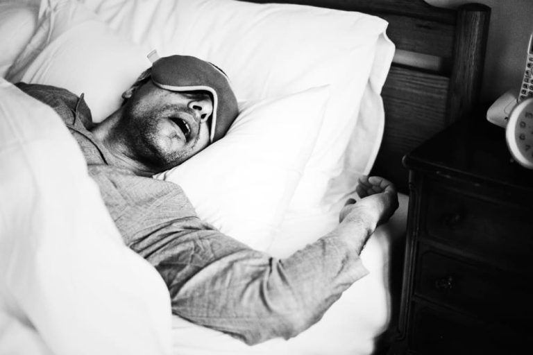 A guy deep in sleep with sleep eye mask