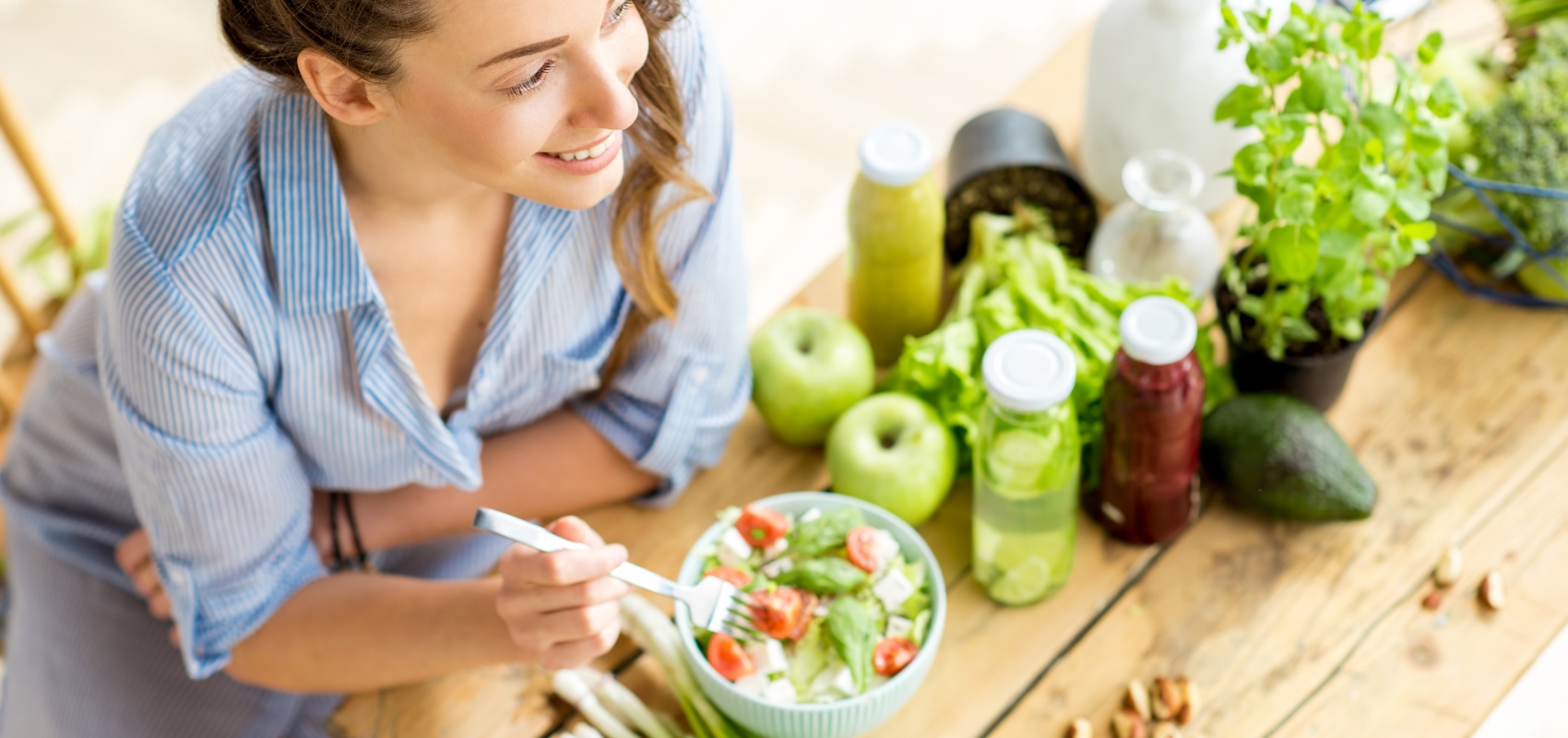 eating a salad next to fresh vegetables