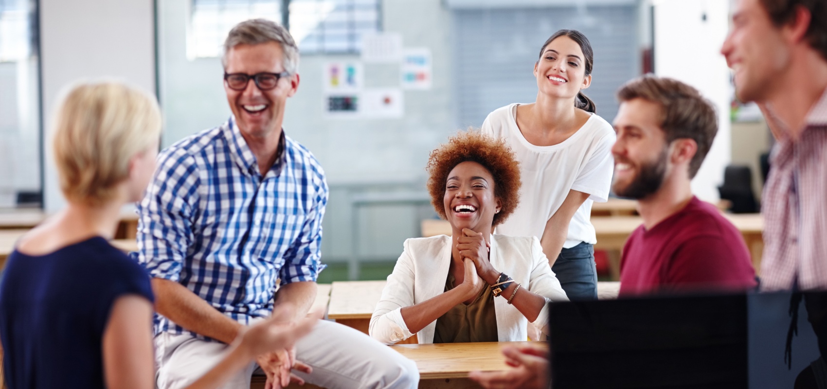 group of coworkers laughing together