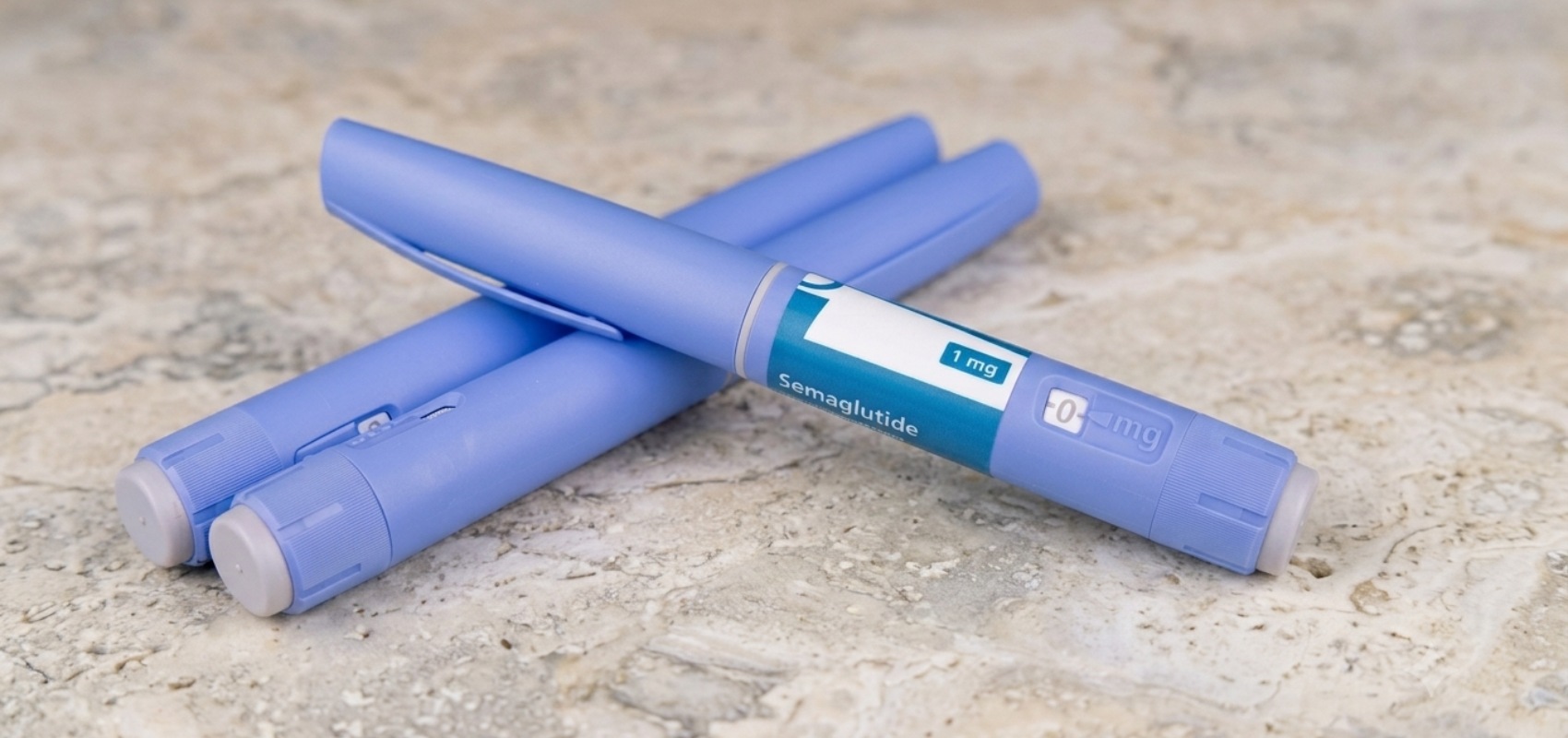 Three blue GLP-1 injection pens