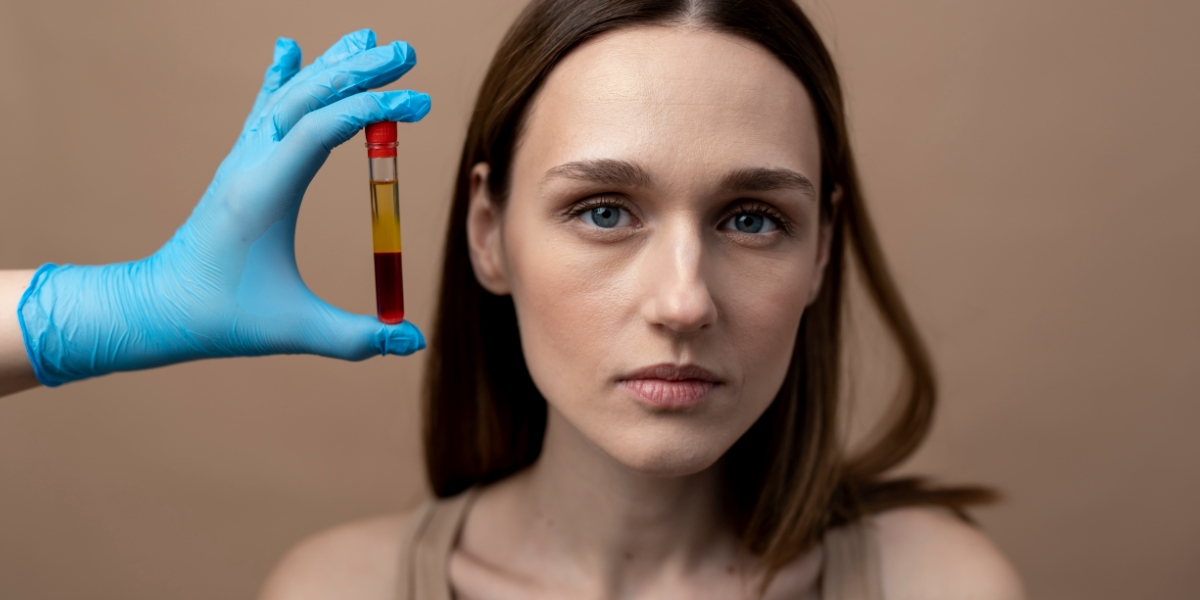 hand holding a prp vial