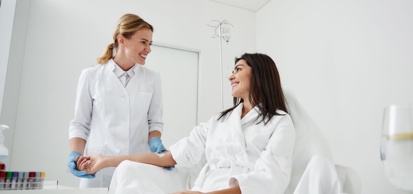 a doctor administers an IV therapy treatment