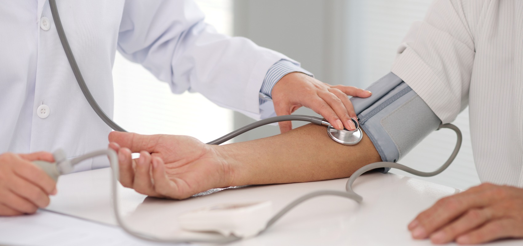 A healthcare provider uses a stethoscope