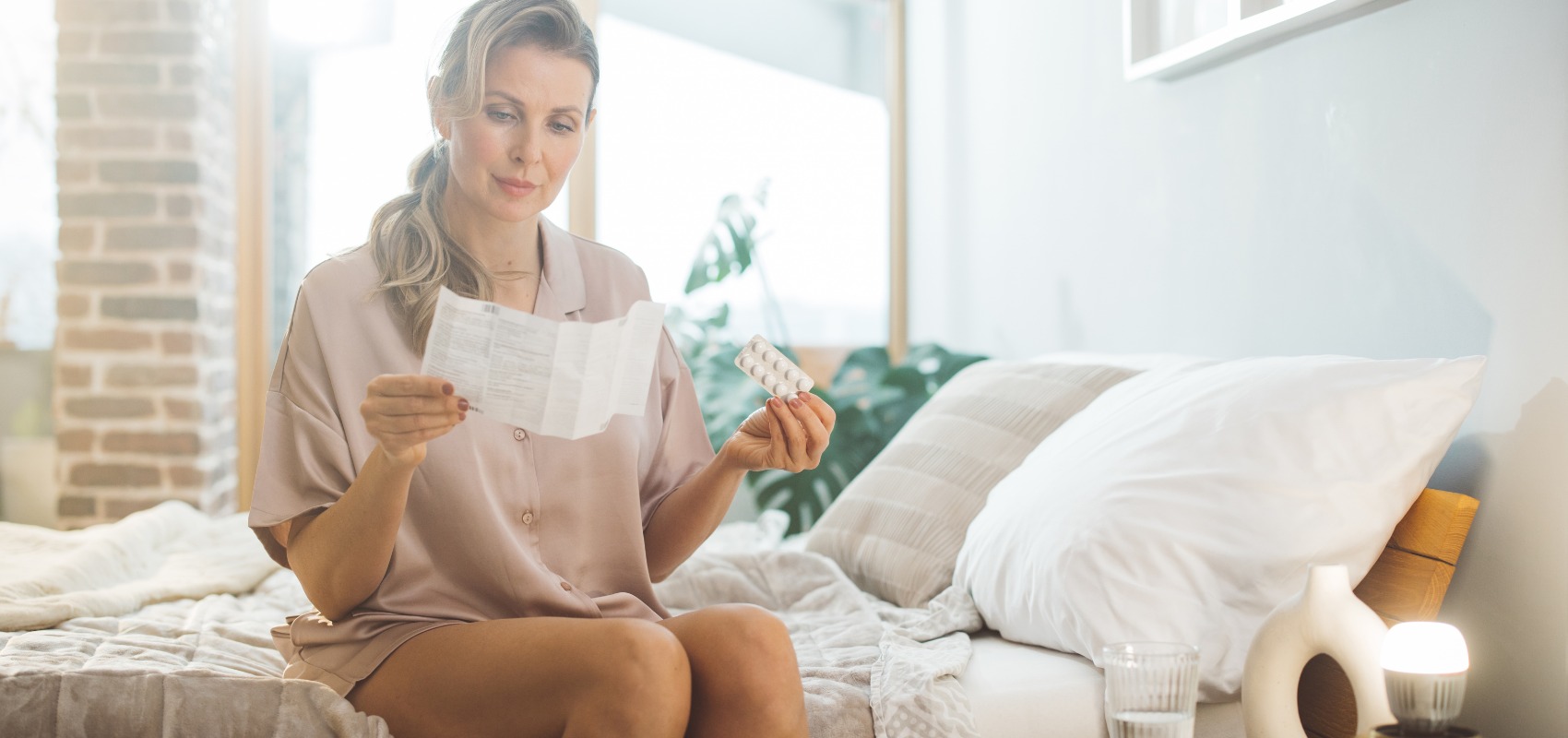 a woman reviews a medication leaflet