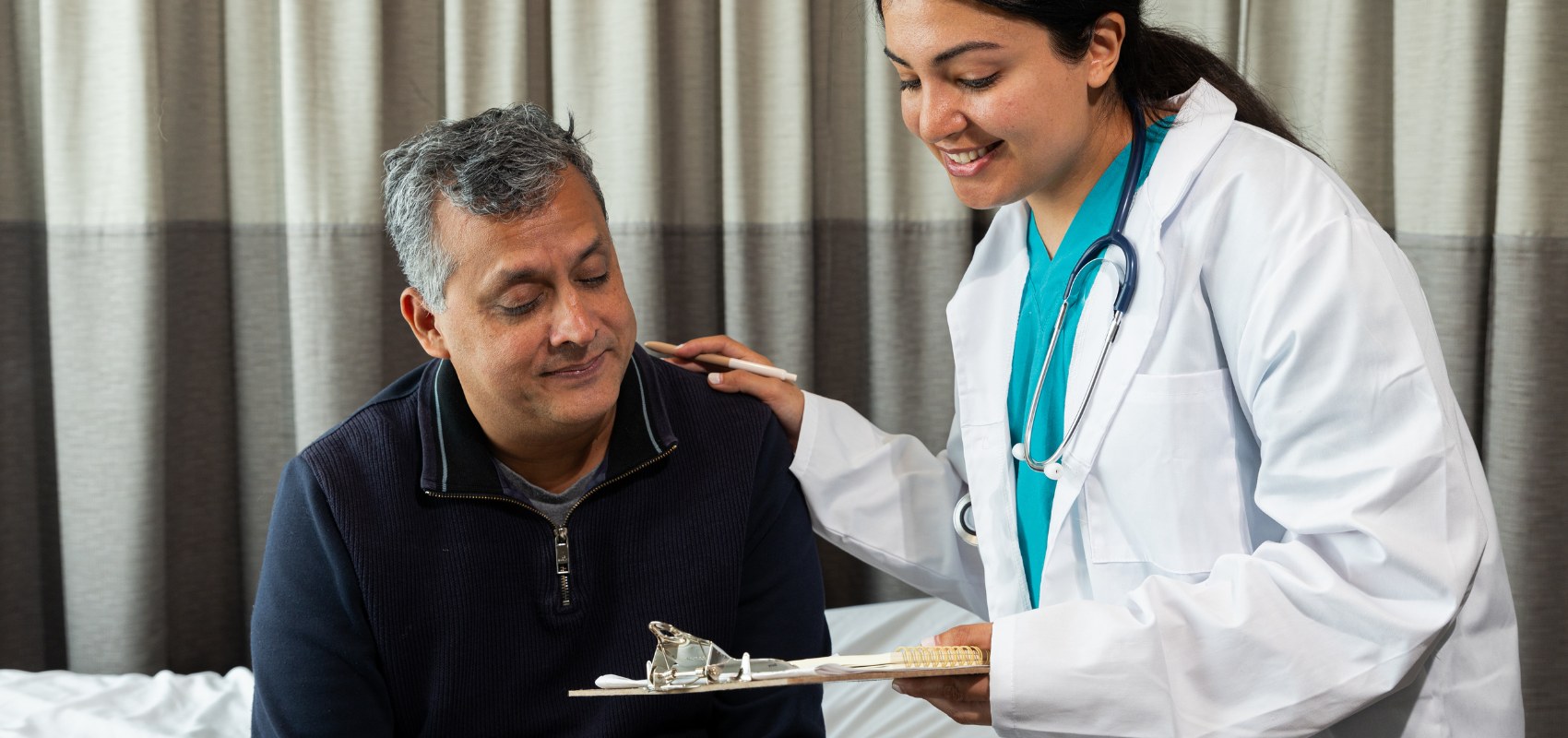 a female doctor talking to a patient