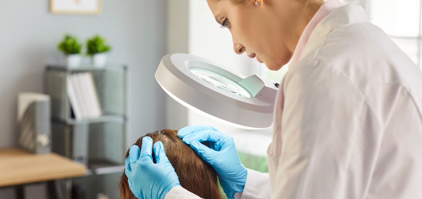examining a patient's hair and scalp