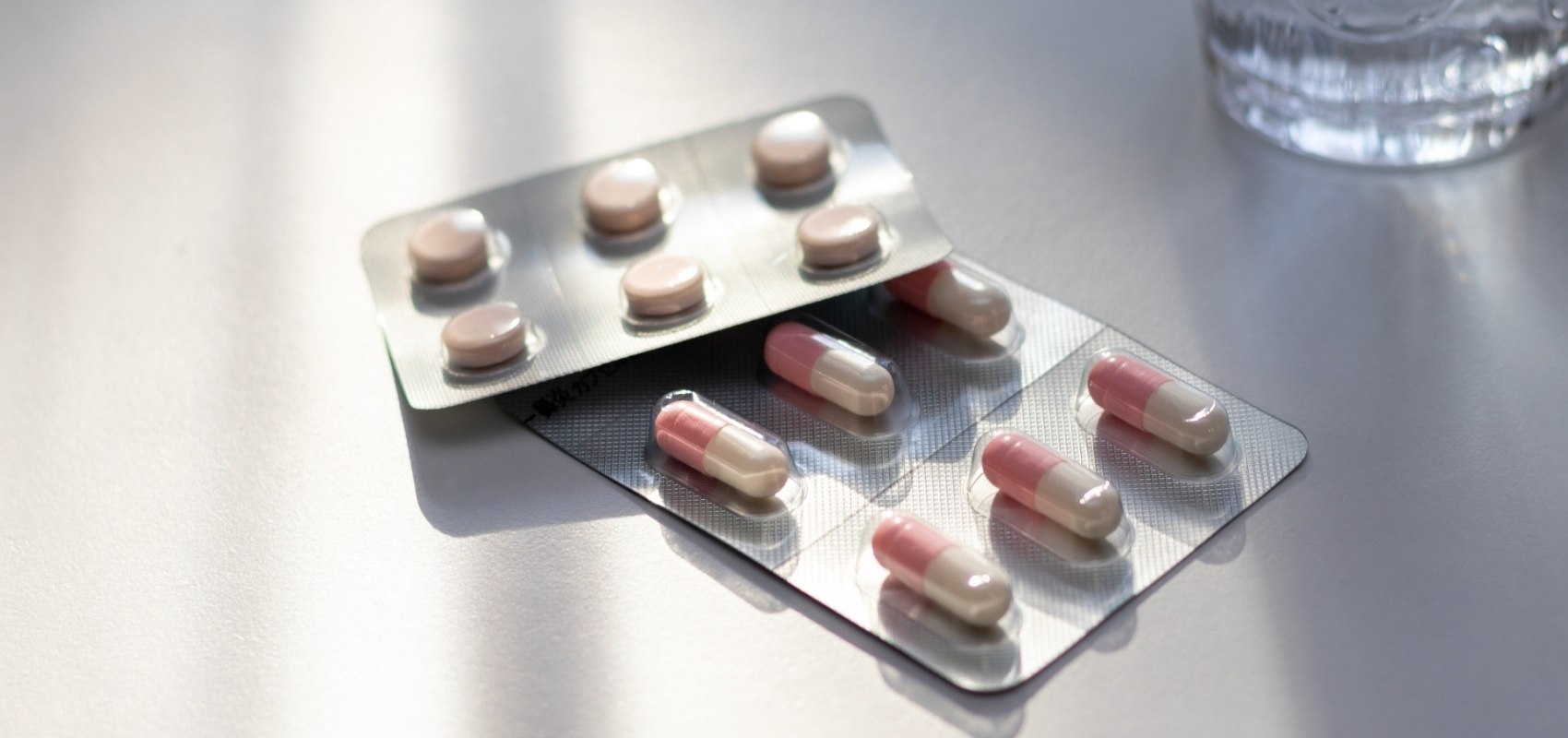 Two blister packs of medication