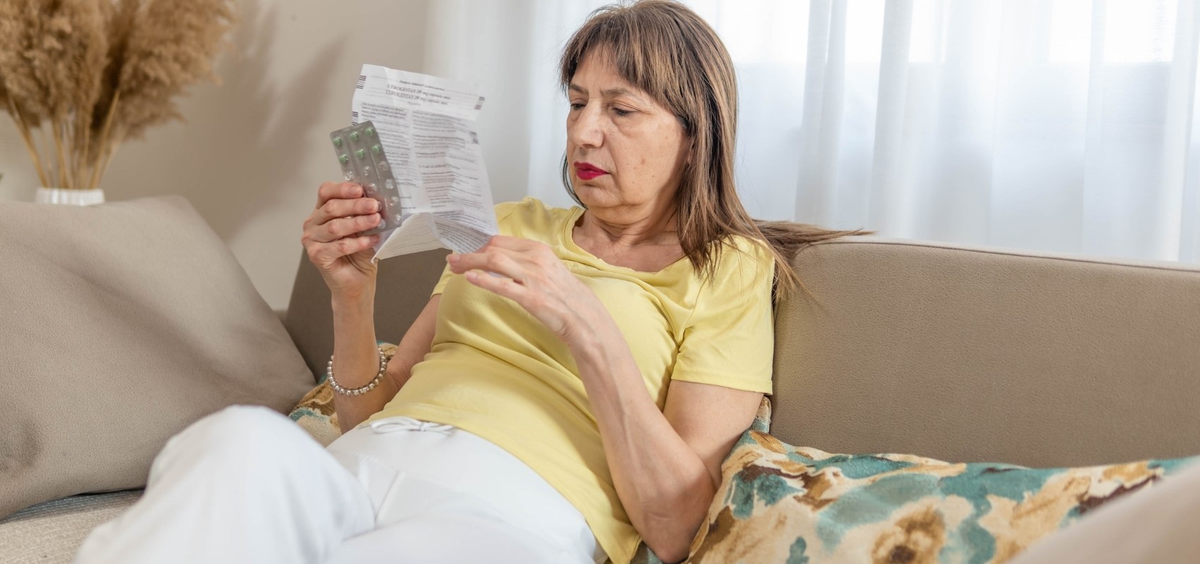 carefully reading the paper leaflet insert of a prescription medication