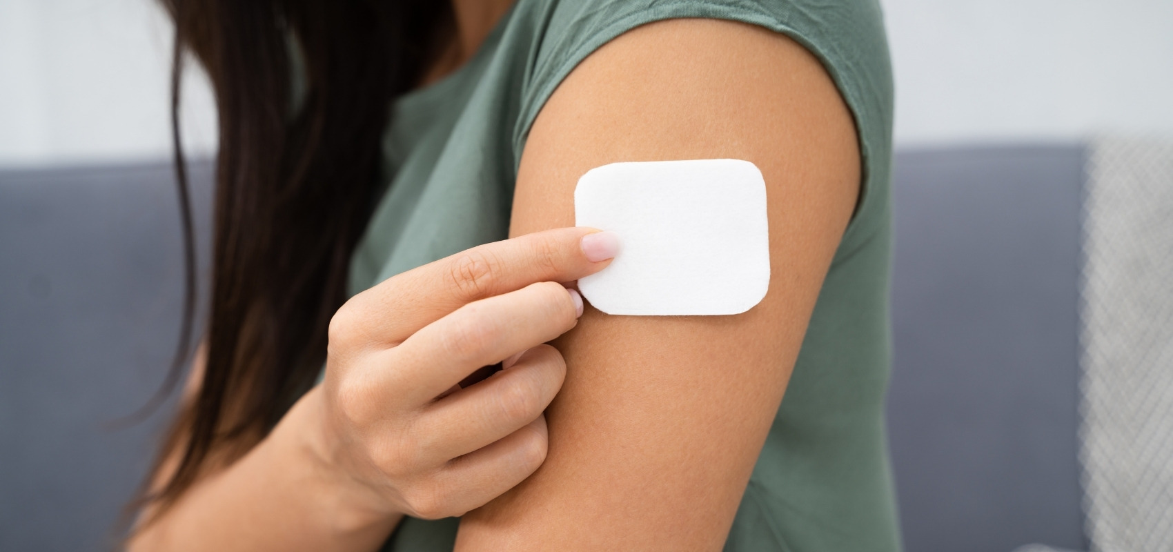 medicated transdermal patch onto her upper arm